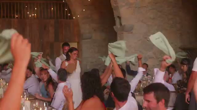 Napkins in the air during lunch, under the stone vault